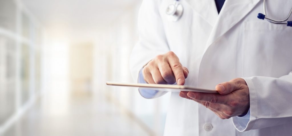 Doctor working on tablet - How technology helps the duties of a nurse