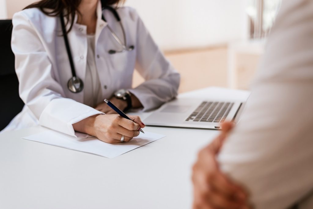 doctor taking notes - medical transcription services