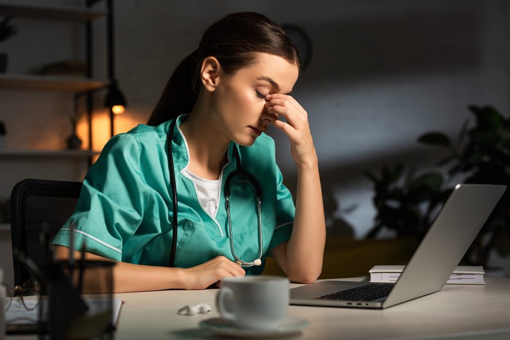 Tired Nurse - Electronic Health Records Causing Major Headaches with Omicron on the Rise