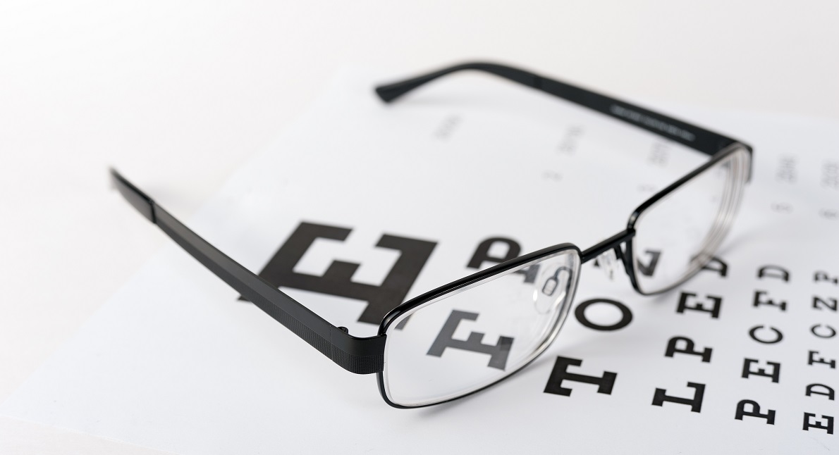 Eye glasses on eyesight test - medical transcription services for eye doctors