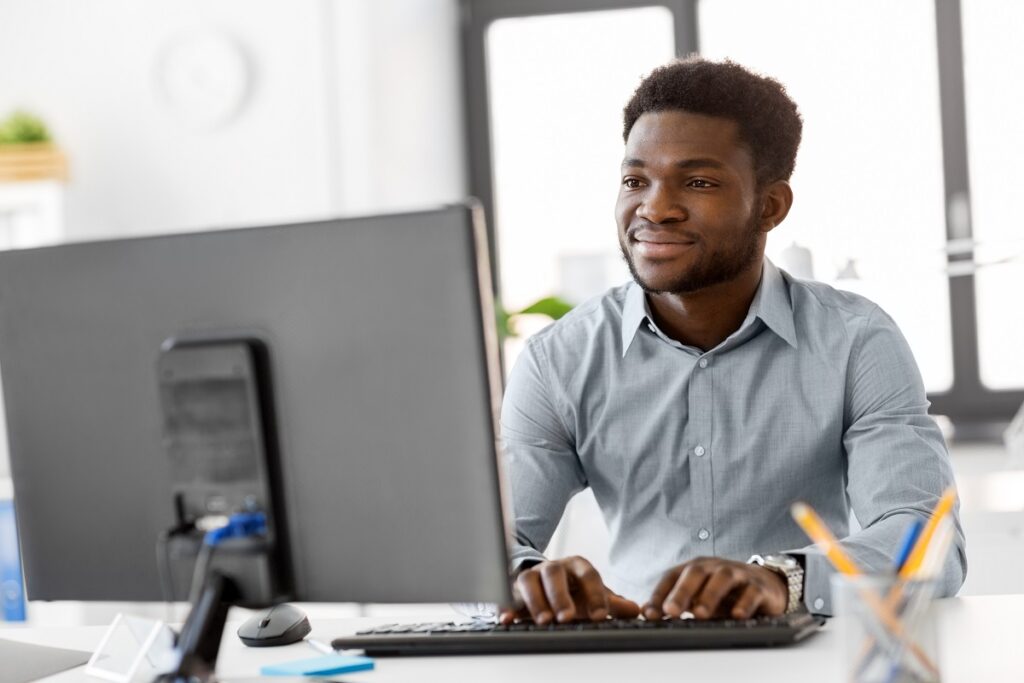 man working on his computer - importance of medical transcription